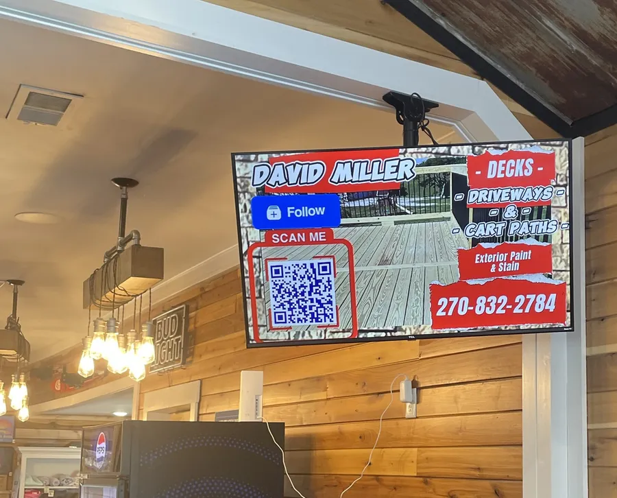 Local contractor ad with QR code on a Buoys display